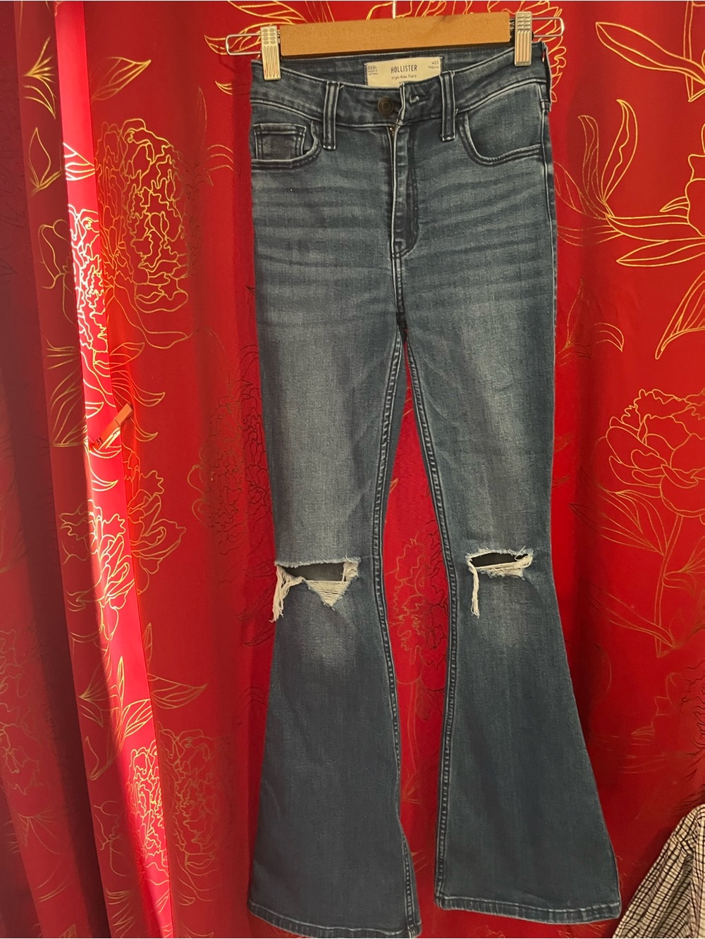 Hollister Women's Flare Jeans in Medium Blue with Knee Distress